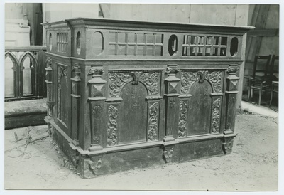 Closed church bench, decorated with wooden beds, in the Niguliste Church.  duplicate photo
