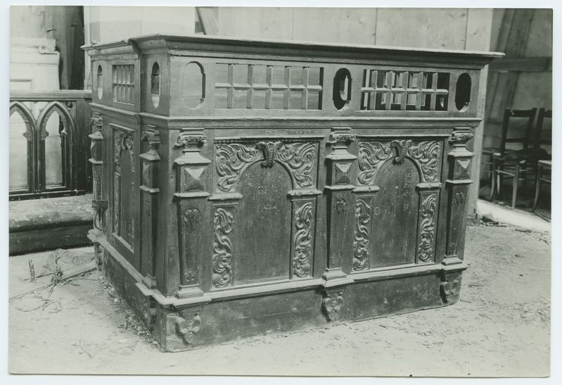 Closed church bench, decorated with wooden beds, in the Niguliste Church.