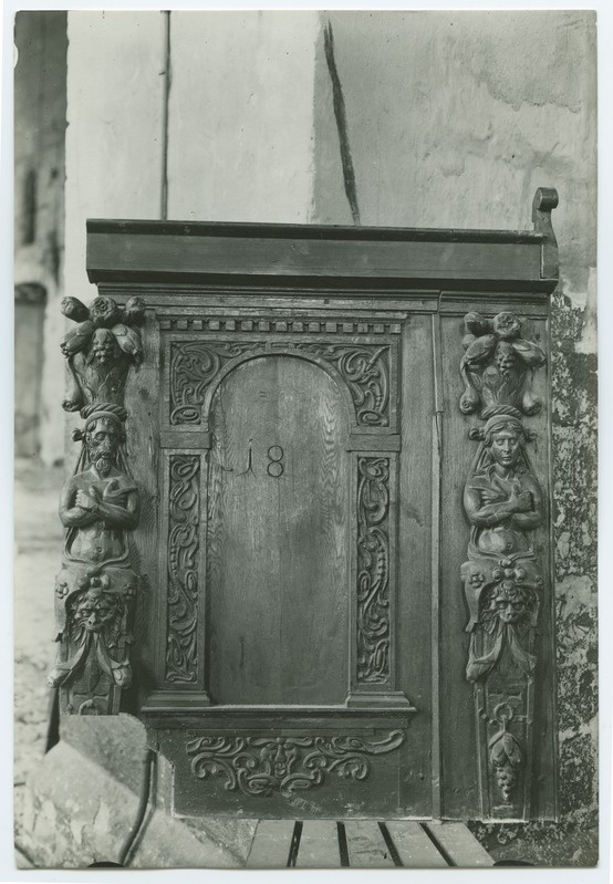 The side of the bench, a man's and a woman's intersection, in the Niguliste Church.