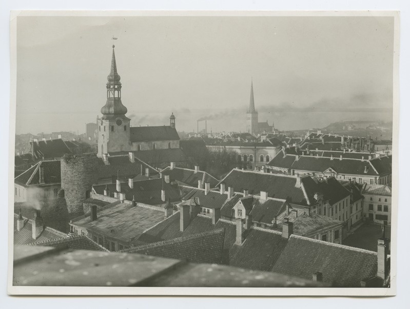View on the roofs of Toompea buildings and the Toom Church, in the background of the Oleviste Church.