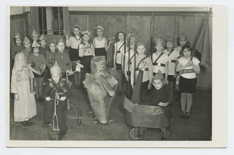 Schoolchildren are playing a war-teemed exhibition game.