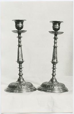 Tallinn. Two altar lighters for one candle  duplicate photo