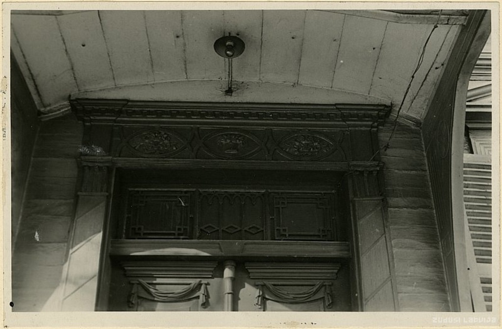 Riga. Wooden residential building at Brīvības iela 78 outdoor door fragment on the side of the yard