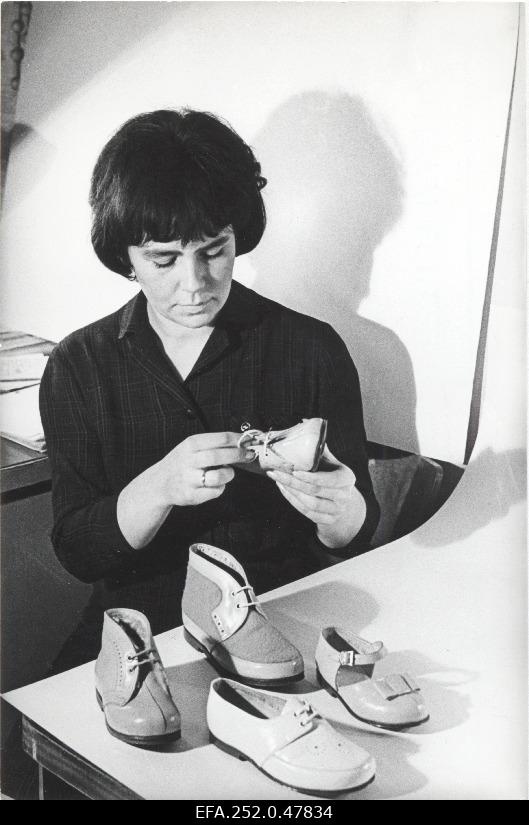 The main artist Tiiu Kreis is looking at new models of children's footwear and footwear production unit.