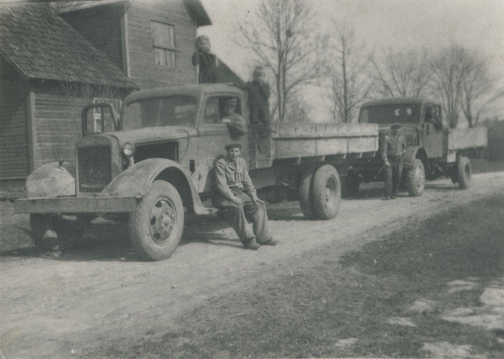 Trucks, four men and two children