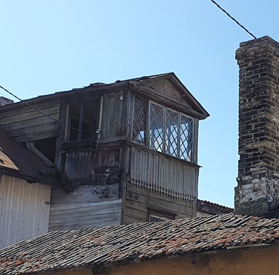 Building on Köie Street. Outdoor building on the rooftop and corners. rephoto
