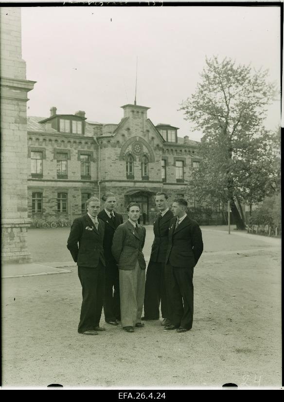A group of students from the State Industrial School in front of the school building.