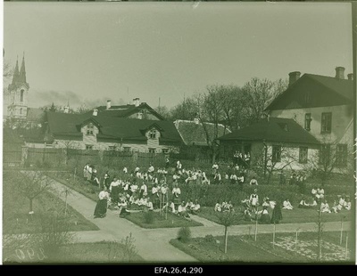 Students of the Tallinn Women's School in folk clothes in the school garden.  similar photo