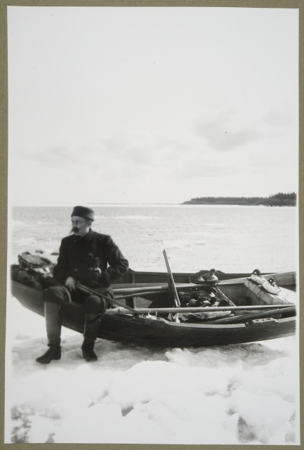 Fisherman with stones in the spring morning in Raahe Archipelago