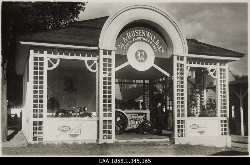 A/S a. Rosenwald & Co Pavilion with motorcycle and tractor.
