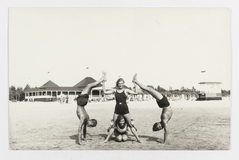 Two ladies and two young men on the beach