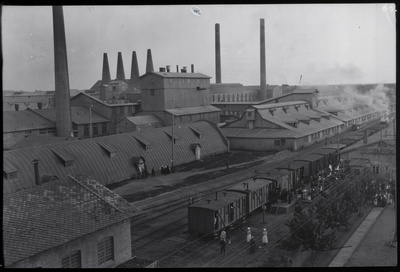 Kunda. On the picture in front of the corner of the depoo, then the Stone Curve. The silo tower has not yet been built. The single corner is one of the two corners of the boilerhouse, the distant two corners are the third factory turning oven corners. The picture also includes the old station building and perroon.  duplicate photo