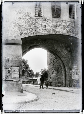 Beach gate, view from the beach gate to the sea. Announcements on the walls of buildings.  duplicate photo