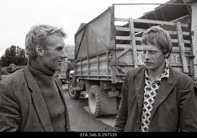 Lihula sovhoosi peaagronoom Sulev Simson and driver Aarne Indres Kirbla in front of the workshop.  similar photo