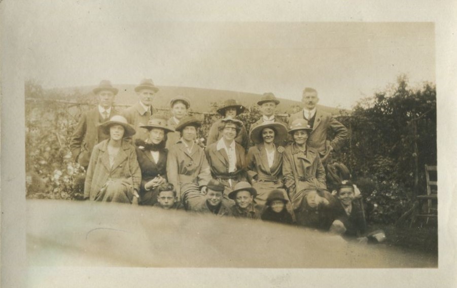Large family group posed in gardens