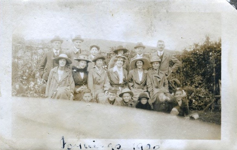 Family group posed in gardens, Poynings, 1920