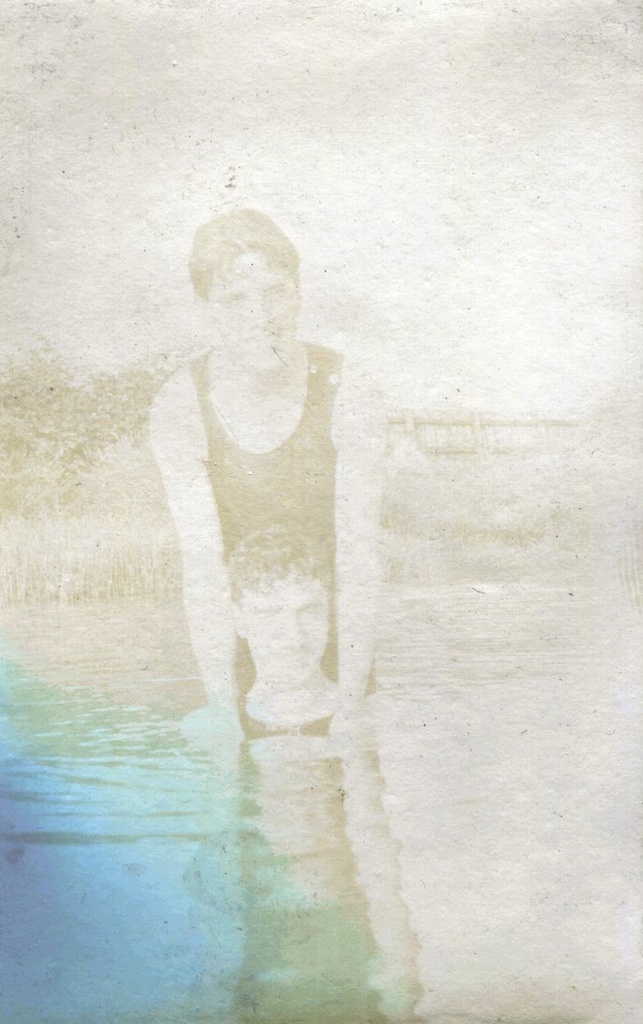 Two males in a lake, one leaning on the other's shoulders, Farnborough