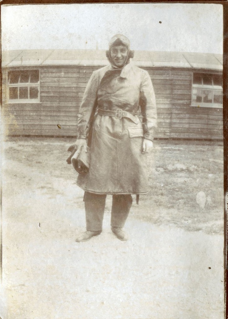 Sgt Reid, standing in flying gear outside a hut, RAF Beaulieu, 1918
