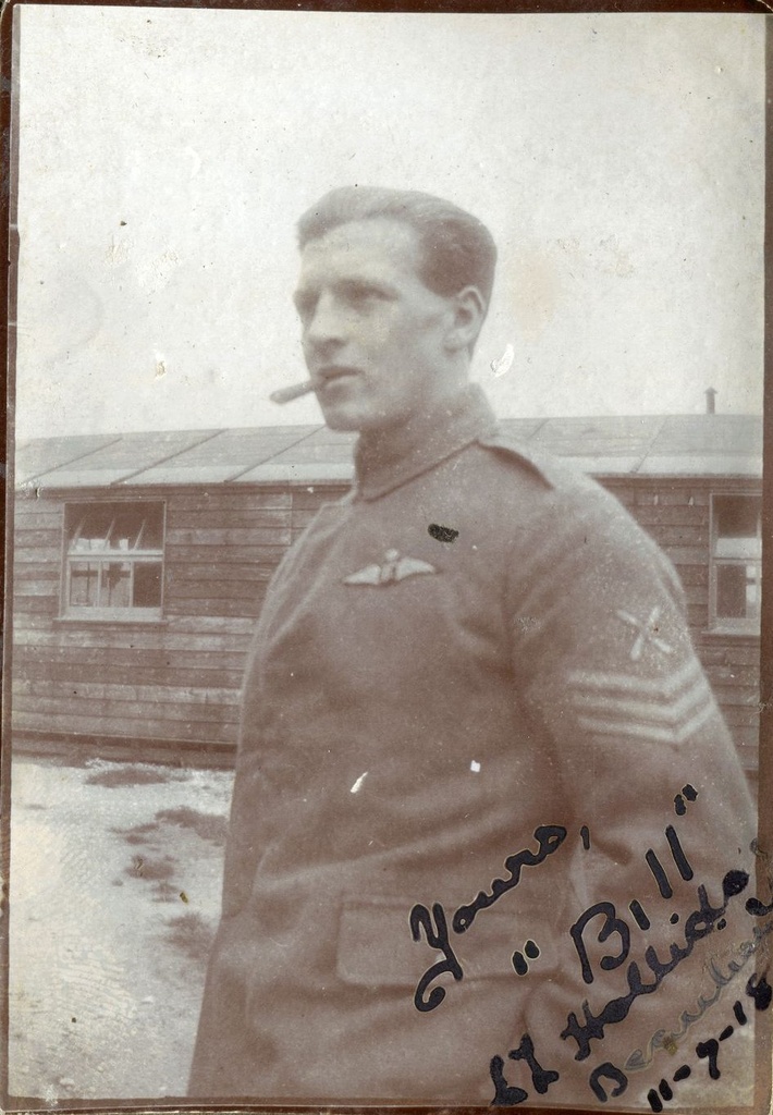 Sgt Halliday standing in uniform outside a hut, Beaulieu, 1918, signed bottom right 'Yours "Bill" Halliday Beaulieu 11-7-18