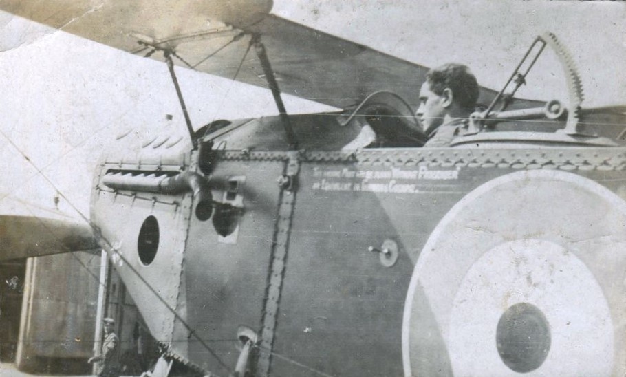 Man seated in Bristol F.2B bi-plane