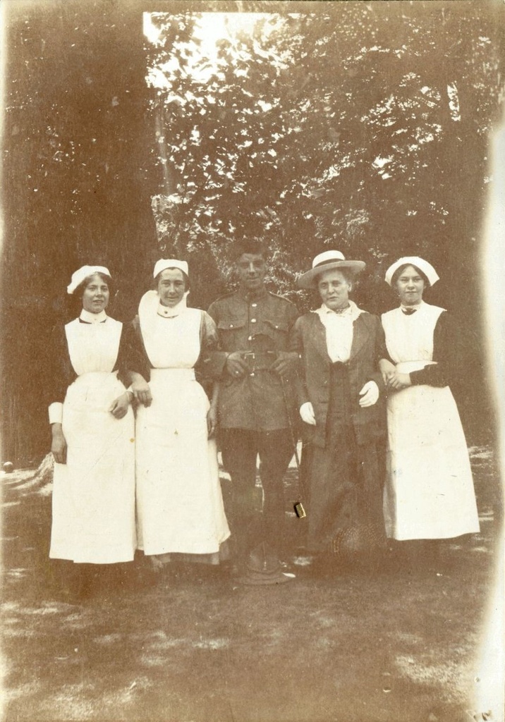 First World War soldier surrounded by four ladies