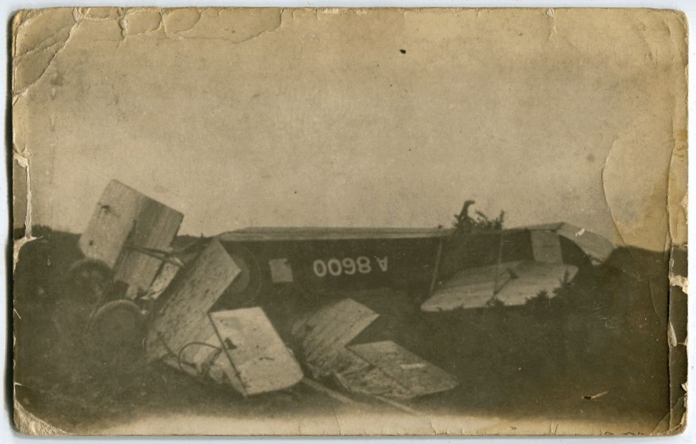 Avro 504 (A8600) bi-plane crash, upside down fuselage