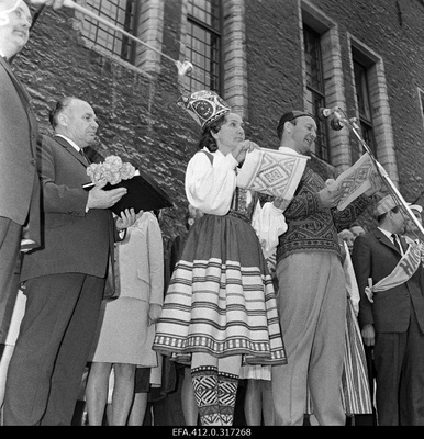 Bringing the fire of the Jubel Festival in Tallinn and miting at the Raekoja Square.  similar photo