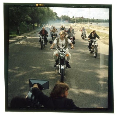 Film extracts. Men drive motorcycles.  similar photo