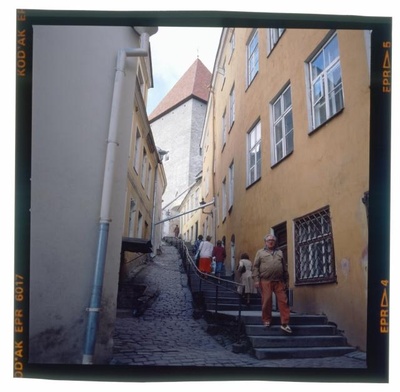 Short leg. In a narrow street, a long staircase.  similar photo