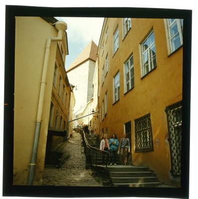 Short leg. In a narrow street, a long staircase.  similar photo