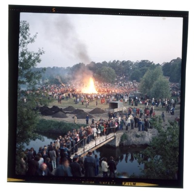 Pirita river views. On the shore a big fire and many people.  similar photo