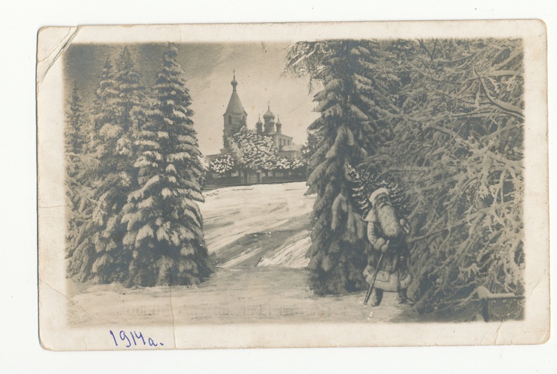 Fotopostkaart lumiste kuuskede, jõuluvana ja taga paistva Issidori kirikuga 1914