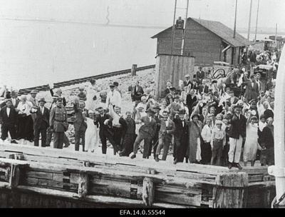 Passengers in the port of Romassaare.  similar photo