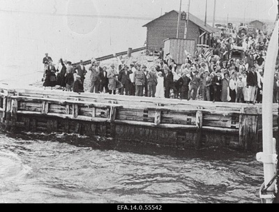 Passengers in the port of Romassaare.  similar photo