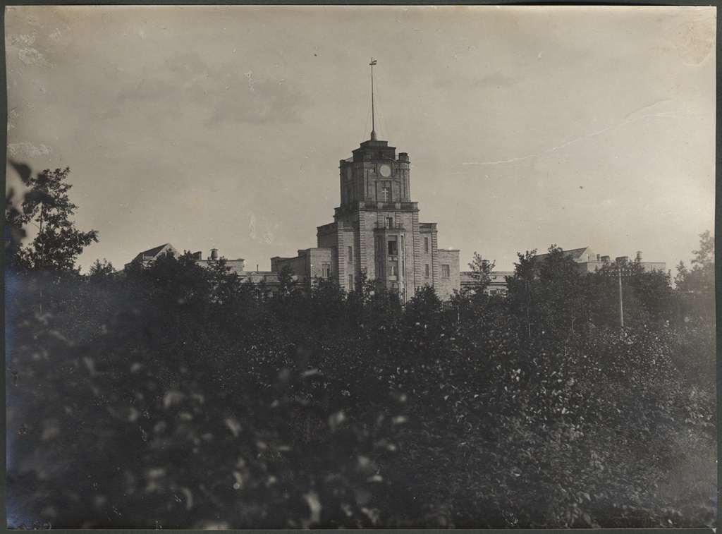 Russian-baltic shipyard. Stone building with a tower on the front of the forest, on the back of the tower