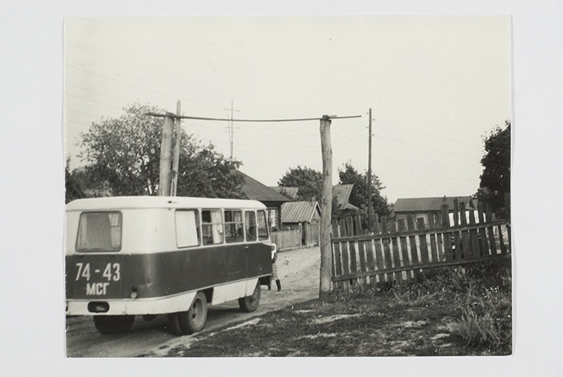 Visiting, the expedition bus enters the village.
