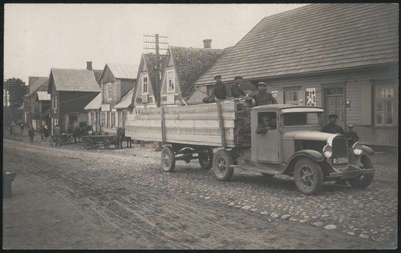 Postcard, Abja, main street, in front of the bus truck store