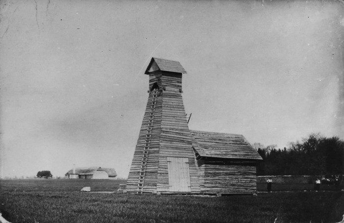 Photocopy. Oil drill tower in the left
