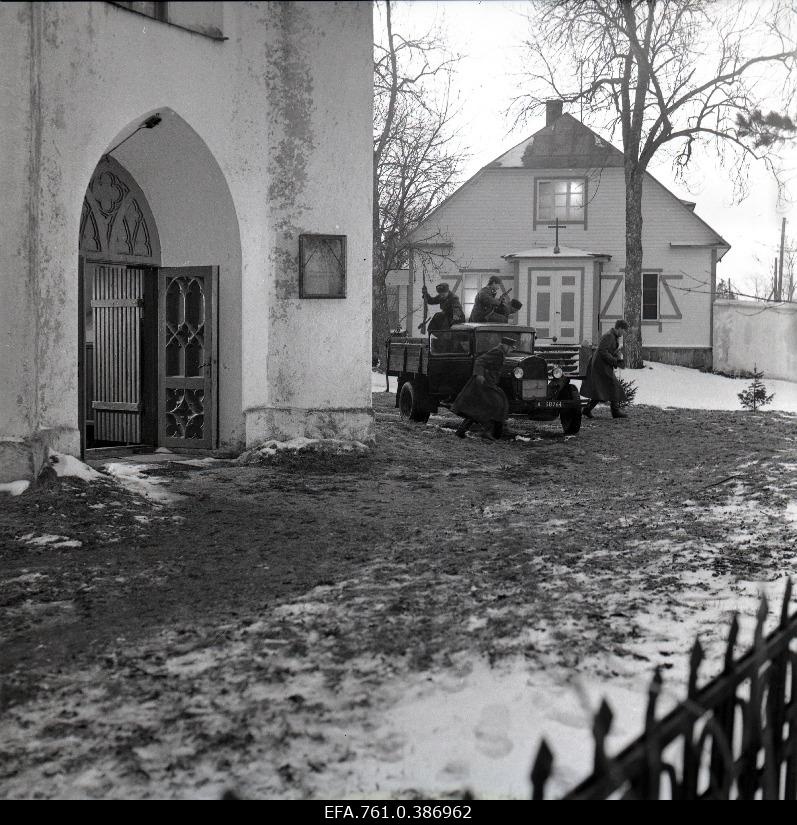 Filming the "Earl" film. The truck of the deporters drives to the church yard.