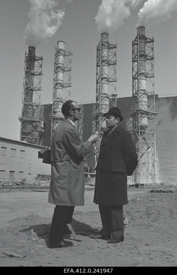 The radio journalist Theophil Source interviews Maardu Chemistry Combination in the background of the partorge.  similar photo