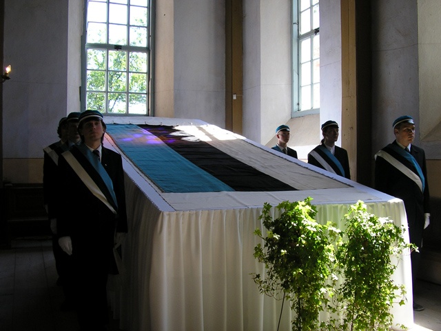 Estonian flag 120. Historical blue-black-white displayed in Otepää church
