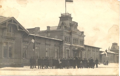 Postcard. In the flaghouses Haapsalu station management, a group of people at the forefront. Black and white. 1920-30th. F. J. Grünthal.  duplicate photo