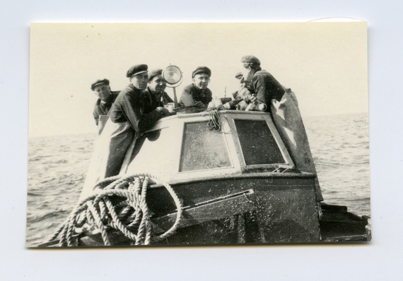 Fishermen with cake in the sea