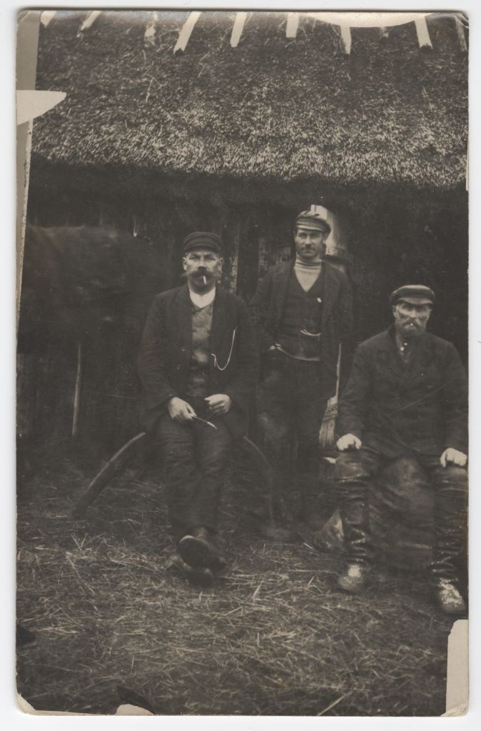 Wooden fishermen in front of the network house in 1923-1924