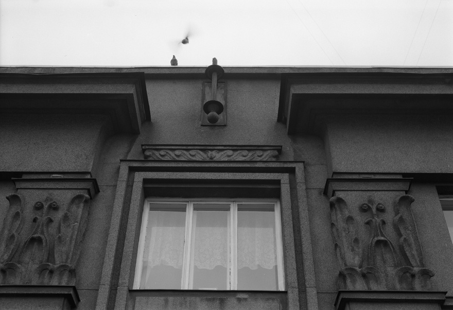Apartment building with shops in Tallinn, Tatari 6, on the facade floor - the top side of the house with flag belts and captains; pictured from the lift. Architect Eugen Sacharias