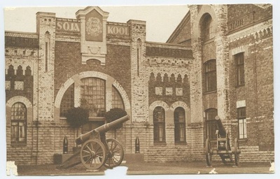 Military school façades and artilleries in front of it.  duplicate photo