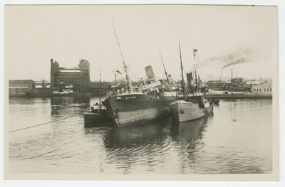 The steamboat "Baltabor" which closed the beach of Naissaare in the port of Tallinn between the rescue ships "Karin" and "Meteor". On the left, the harbor elevator and the right passenger building appear farther away.  similar photo