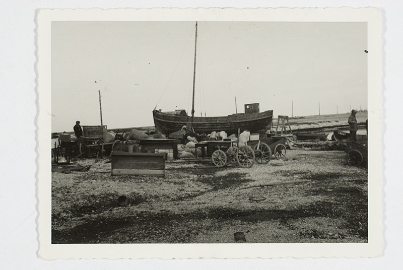 Evacuated goods on the port bridge, in the middle of a large motor boat drawn on dry, which was left behind. Osmussaar, 11. Vi 40