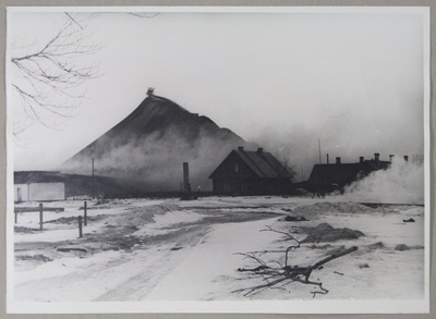 Stone oil. Smoke burning of the mine on the feet of the ash mountain and mountain  duplicate photo