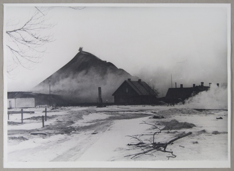 Stone oil. Smoke burning of the mine on the feet of the ash mountain and mountain